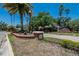 Brick community sign with decorative landscaping, indicating a well-maintained neighborhood at 16367 Ashington Park Dr, Tampa, FL 33647