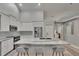 Modern kitchen with an island, stainless steel appliances, and a breakfast bar at 16367 Ashington Park Dr, Tampa, FL 33647