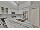 Modern kitchen with a center island, stainless steel appliances, and white cabinetry at 16367 Ashington Park Dr, Tampa, FL 33647