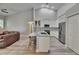 Stylish kitchen featuring stainless steel appliances, a large island, and white cabinets at 16367 Ashington Park Dr, Tampa, FL 33647