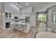 Well-lit kitchen featuring stainless steel appliances, a wine fridge, and island seating at 16367 Ashington Park Dr, Tampa, FL 33647