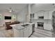 Modern kitchen with a large island, stainless steel appliances, and an open layout at 16367 Ashington Park Dr, Tampa, FL 33647