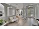 Open-concept living space with neutral paint, modern lighting, and views into other rooms of the house at 16367 Ashington Park Dr, Tampa, FL 33647