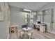 Bright sitting room with neutral paint, modern lighting fixture, and lots of natural light at 16367 Ashington Park Dr, Tampa, FL 33647