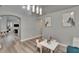 Sitting room with neutral paint, modern lighting fixture, and views to adjacent rooms at 16367 Ashington Park Dr, Tampa, FL 33647