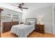 Comfortable bedroom with a ceiling fan, natural light, and tasteful furnishings at 1701 Pinehurst Rd # 9G, Dunedin, FL 34698