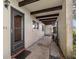 Inviting front porch features tiled entryway and decorative beams above at 1701 Pinehurst Rd # 9G, Dunedin, FL 34698