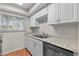 Bright kitchen featuring granite countertops, stainless steel appliances and ample storage space at 1701 Pinehurst Rd # 9G, Dunedin, FL 34698