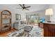 Comfortable living room featuring a plush sofa and a view of the screened-in porch at 1701 Pinehurst Rd # 9G, Dunedin, FL 34698