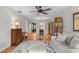 Bright living room featuring stylish furnishings, hardwood floors, and a ceiling fan at 1701 Pinehurst Rd # 9G, Dunedin, FL 34698