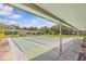 View of shuffleboard courts with benches, providing a recreational amenity for residents at 1701 Pinehurst Rd # 9G, Dunedin, FL 34698