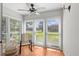 Charming sun room with large windows offering ample natural light and serene views at 1701 Pinehurst Rd # 9G, Dunedin, FL 34698