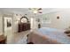 Bedroom with hardwood furniture, and neutral paint scheme that adds to the charm at 1707 Hibiscus S Cir, Oldsmar, FL 34677