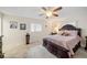 This bedroom features a ceiling fan, tile floors, and neutral walls at 1707 Hibiscus S Cir, Oldsmar, FL 34677