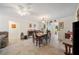 Bright dining room featuring tile floors, a ceiling fan, and elegant furnishings at 1707 Hibiscus S Cir, Oldsmar, FL 34677