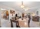 Open-concept living room with dining area, tile flooring, and neutral paint color scheme at 1707 Hibiscus S Cir, Oldsmar, FL 34677