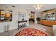 Living area with colorful rug, stylish console table, and bright, airy space with open floor plan at 1707 Hibiscus S Cir, Oldsmar, FL 34677