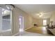 Spacious living room with hardwood floors, fireplace, and natural light at 17508 Isbell Ln, Odessa, FL 33556
