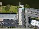 An overhead angle shows the property, parking area and surrounding waterway and landscape at 1859 Shore S Dr # 202, South Pasadena, FL 33707