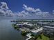 Aerial view of waterfront community featuring a pool and surrounding inter coastal waters at 1859 Shore S Dr # 202, South Pasadena, FL 33707