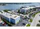 An aerial perspective of the community showcases the parking and beautiful waterfront views at 1859 Shore S Dr # 202, South Pasadena, FL 33707