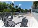 Relaxing deck with lounge chairs, providing a peaceful retreat with shade at 1859 Shore S Dr # 202, South Pasadena, FL 33707