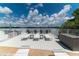 Spacious deck with lounge chairs and water views offers ideal outdoor relaxation at 1859 Shore S Dr # 202, South Pasadena, FL 33707