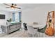 Bright dining room with white walls, light gray plank flooring and a modern four-chair table at 1859 Shore S Dr # 202, South Pasadena, FL 33707