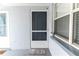 Charming front door with welcome mat and a view of unit 202 at 1859 Shore S Dr # 202, South Pasadena, FL 33707