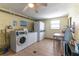 Well-maintained laundry room featuring multiple washers and dryers, plus folding area at 1859 Shore S Dr # 202, South Pasadena, FL 33707
