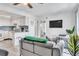 Well-lit living room features an open floorplan with modern furniture and a view of the kitchen at 1859 Shore S Dr # 202, South Pasadena, FL 33707