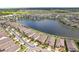 Aerial view of a home near a beautiful lake, with a path to the Meridian Clubhouse at 19183 Coastal Shore Ter, Land O Lakes, FL 34638