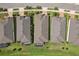 Birds eye view of homes with gray roofs and green lawns at 19183 Coastal Shore Ter, Land O Lakes, FL 34638