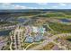 Beautiful aerial view highlighting community's pools, lakes, tennis courts and landscaped grounds at 19183 Coastal Shore Ter, Land O Lakes, FL 34638