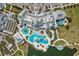 Aerial view of community pool with sun loungers, cabanas and umbrellas at 19183 Coastal Shore Ter, Land O Lakes, FL 34638