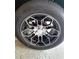 Close-up of a stylish car wheel, featuring black rims with a unique silver geometric design and a modern aesthetic at 19183 Coastal Shore Ter, Land O Lakes, FL 34638
