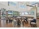 Beautiful clubhouse area featuring tables, chairs, decor, and a view of the grounds at 19183 Coastal Shore Ter, Land O Lakes, FL 34638