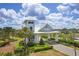 Community entrance features a modern design and lush landscaping at 19183 Coastal Shore Ter, Land O Lakes, FL 34638