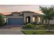 Charming single-story home with a well-manicured lawn and inviting front entrance at 19183 Coastal Shore Ter, Land O Lakes, FL 34638