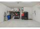 Spacious garage featuring epoxy flooring and ample room for storage with shelves at 19183 Coastal Shore Ter, Land O Lakes, FL 34638