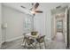 Bright, neutral guest bedroom with wood-look floors, ceiling fan, and closet at 19183 Coastal Shore Ter, Land O Lakes, FL 34638