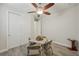 Neutral guest bedroom with wood-look floors, ceiling fan, and closet at 19183 Coastal Shore Ter, Land O Lakes, FL 34638