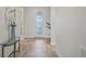 Inviting hallway with stylish flooring and decorative front door at 19183 Coastal Shore Ter, Land O Lakes, FL 34638