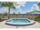 Inviting community hot tub provides a relaxing retreat with clear blue water, manicured landscaping, and a tranquil atmosphere at 19183 Coastal Shore Ter, Land O Lakes, FL 34638