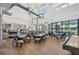 Bright interior with modern chairs, tables, and large windows at 19183 Coastal Shore Ter, Land O Lakes, FL 34638