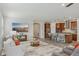 Open-concept living room with modern decor, kitchen, and comfortable seating area perfect for relaxation at 19183 Coastal Shore Ter, Land O Lakes, FL 34638