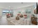 Spacious living room with tile floors and ample natural light at 19183 Coastal Shore Ter, Land O Lakes, FL 34638