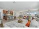 Spacious living area featuring a modern kitchen, dining space, and comfortable seating with a view at 19183 Coastal Shore Ter, Land O Lakes, FL 34638