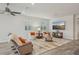 Bright living room with recessed lighting, stylish decor, and tile flooring at 19183 Coastal Shore Ter, Land O Lakes, FL 34638