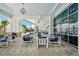 Relaxing patio area with comfortable seating, offering a view of the surrounding landscape at 19183 Coastal Shore Ter, Land O Lakes, FL 34638